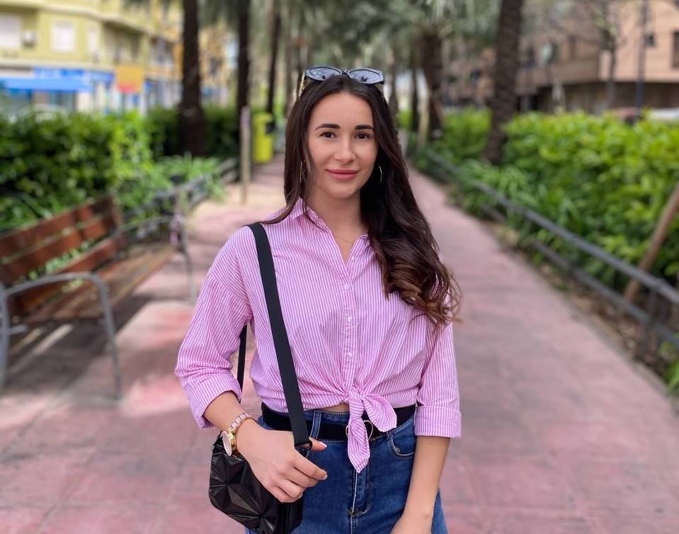 Kamilla A., Migrun case manager, smiling outdoors